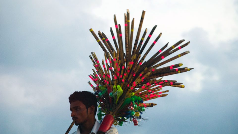 Picture of a flute vendor in India